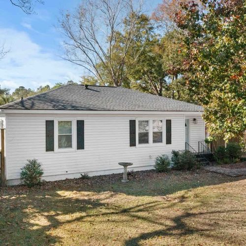 The front yard offers ample space to comfortably accommodate parking for two vehicles.