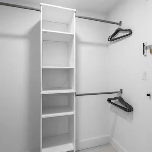 The bathroom is thoughtfully designed with his-and-hers mirrors, plenty of storage cabinets, and a spacious closet, offering both comfort and convenience for an extended stay or a relaxing getaway.