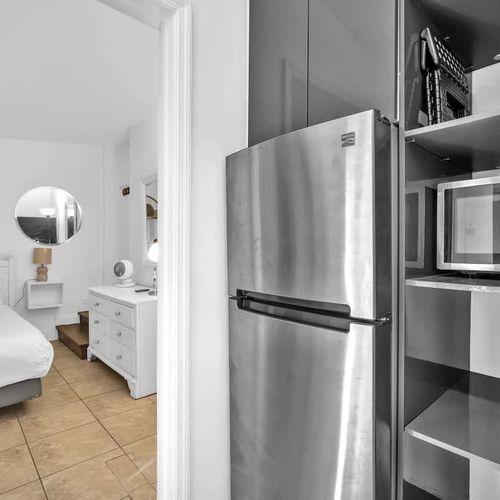 Spacious kitchenette ideal for overnight stays or travelers who want the convenience of light meal prep without full cooking.