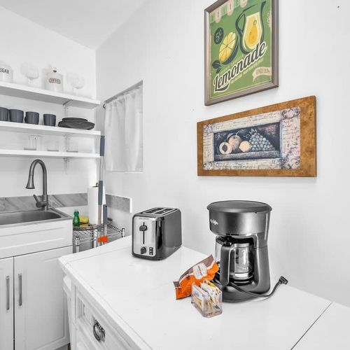 Spacious kitchenette ideal for overnight stays or travelers who want the convenience of light meal prep without full cooking.