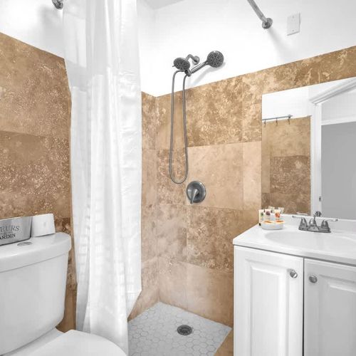 The unit includes a generously sized bathroom with all the basic essentials provided.