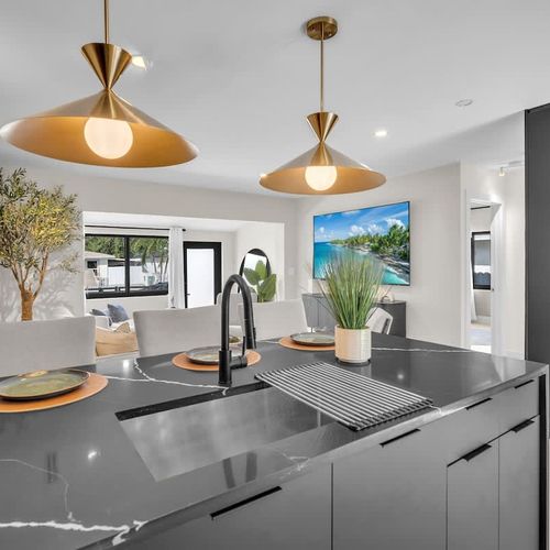 Enjoy meals at the dining bar with convenient access to the sink.