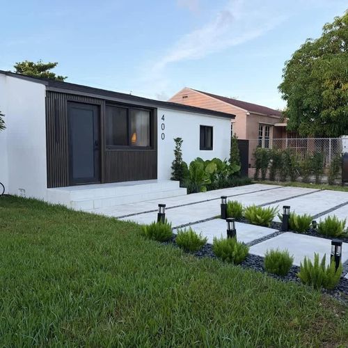 Gated home with a front lawn and driveway for your convenience!