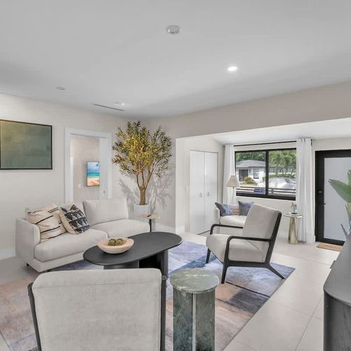 Spacious yet cozy living area, featuring a comfortable seating setup and a TV for your entertainment.