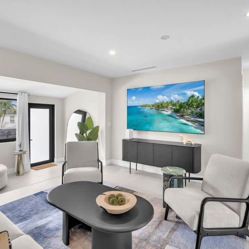 Relax on the comfortable sofa in the living area while enjoying your favorite movies on the big TV!