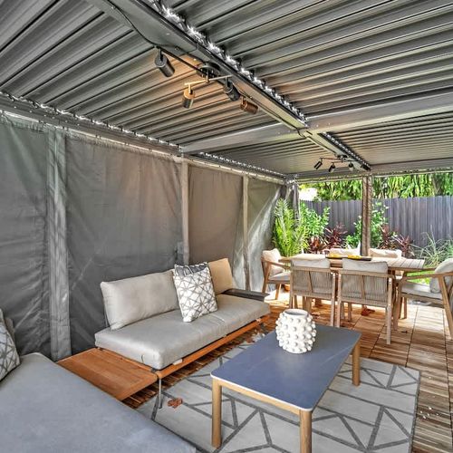 Enjoy privacy and comfort in our covered backyard cabana.