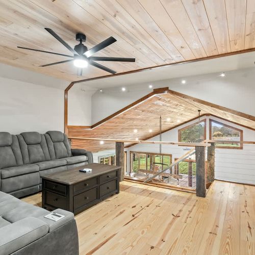 Charming loft lounge with comfortable seating, ideal for movie nights, catching up on TV, or unwinding after a day of exploring.