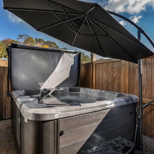Unwind and soak in the relaxing hot tub, perfect for a peaceful evening after a day of exploring.