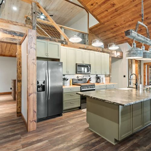 Spacious fully equipped kitchen with ample storage, stocked with all the essentials you need to prepare delicious meals for family or friends