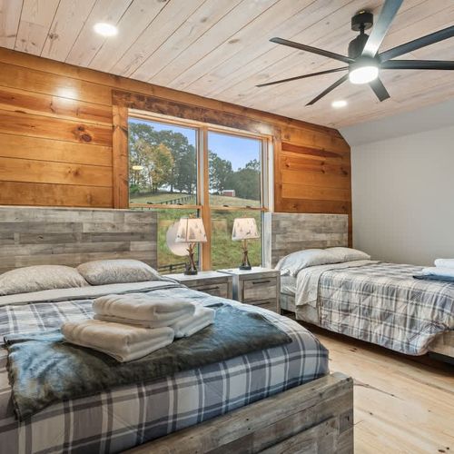 The bedrooms feature cozy, comfortable beds with fresh, crisp linens for a restful night’s sleep.