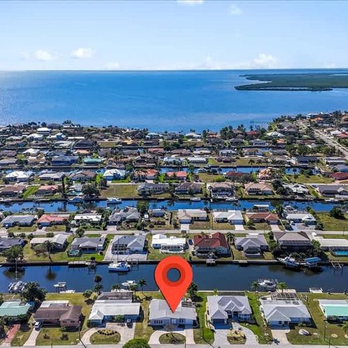 Experience the charm of this waterfront Port Charlotte home, perfectly situated for tranquility, water views, and outdoor enjoyment.