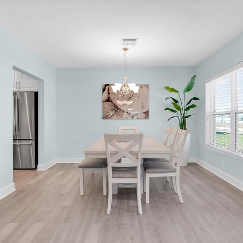 Enjoy your meals in the comfort of the dining area or by the pool.