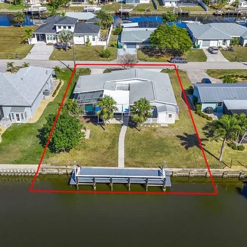 Experience the charm of this waterfront Port Charlotte home, perfectly situated for tranquility, water views, and outdoor enjoyment.