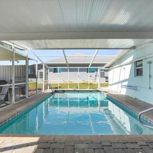 Enjoy the heated pool while soaking in tranquil canal scenery.