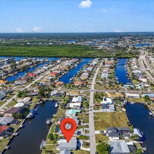 Experience the charm of this waterfront Port Charlotte home, perfectly situated for tranquility, water views, and outdoor enjoyment.