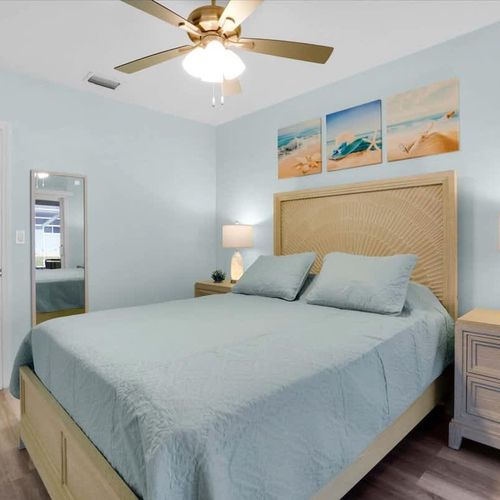 Each bedroom is thoughtfully furnished with crisp linens, cozy pillows, and pool access, ideal for a relaxing vacation or getaway.