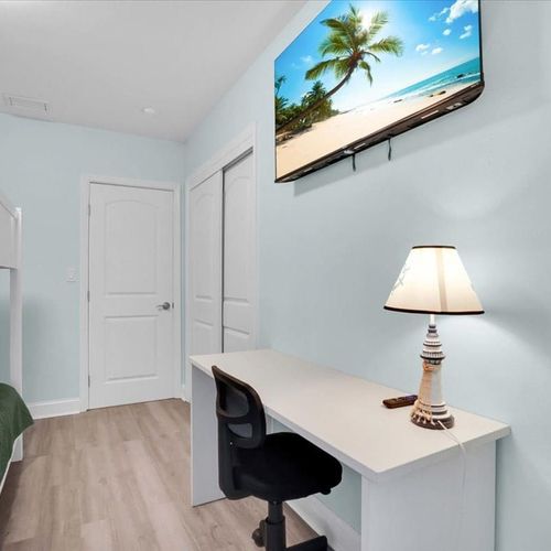 All bedrooms feature cozy beds and individual TVs, perfect for relaxing and enjoying private entertainment.