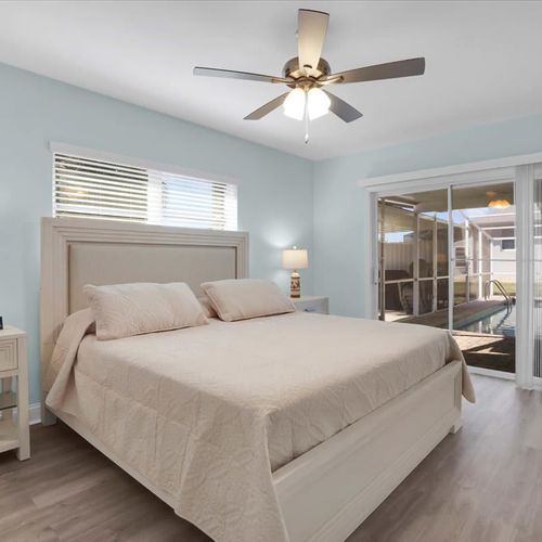 Each bedroom is thoughtfully furnished with crisp linens, cozy pillows, and pool access, ideal for a relaxing vacation or getaway.