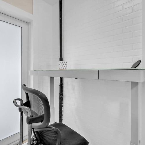 Stay productive with a dedicated work area complete with a desk and office chair.