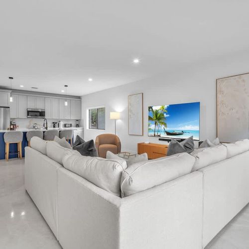 Both units have spacious living rooms with a sofa bed and widescreen TV for relaxing and entertainment after a day of exploring.