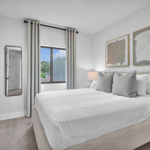 Bedroom  5 & 6 feature a queen-sized bed with plush bedding and a calm, comfortable vibe for a great night’s sleep.