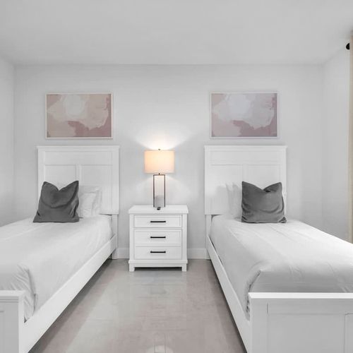 Bedroom 7&8 offer two cozy single beds in each room, private TVs, generous closet space, and an ensuite bathroom—an excellent choice for kids or families needing extra room and comfort.