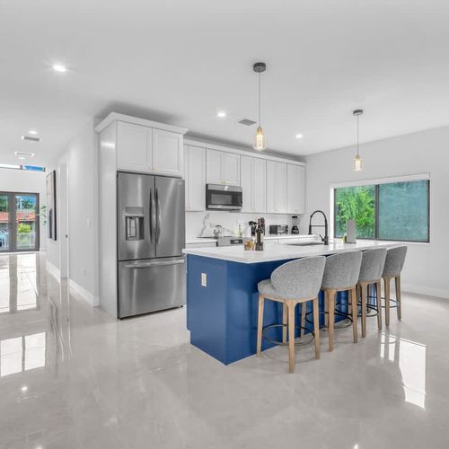 Both units feature spacious modern kitchen with a large island, plenty of storage, and all the essentials to cook your favorite meals during your stay.