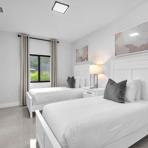 Bedroom 7&8 offer two cozy single beds in each room, private TVs, generous closet space, and an ensuite bathroom—an excellent choice for kids or families needing extra room and comfort.