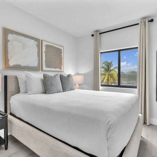 Bedroom  5 & 6 feature a queen-sized bed with plush bedding and a calm, comfortable vibe for a great night’s sleep.