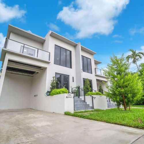 The parking spaces in both units can accommodate up to 2 cars each.