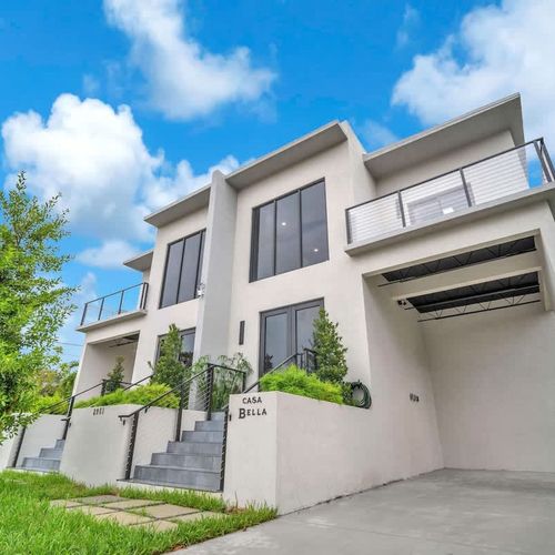 The parking spaces in both units can accommodate up to 2 cars each.