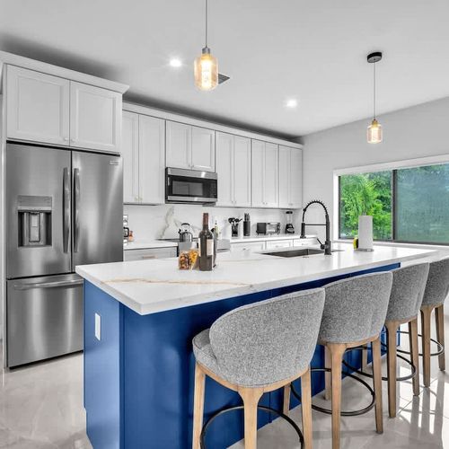 Both units feature spacious modern kitchen with a large island, plenty of storage, and all the essentials to cook your favorite meals during your stay.