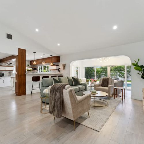 Spacious living area with comfortable seating and a large smart TV, designed for lounging, streaming, and shared downtime.