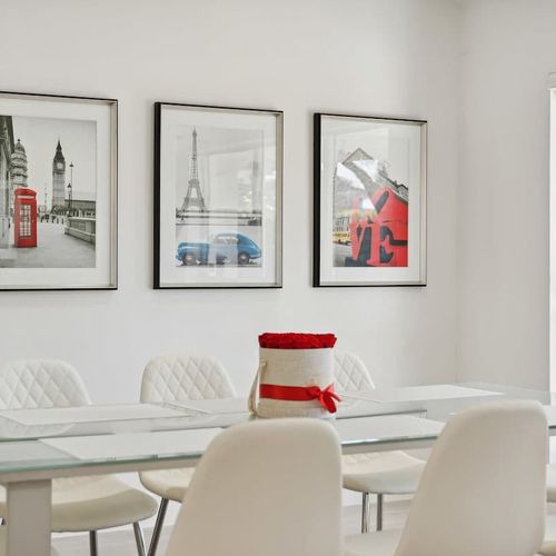 Spacious dining space featuring a sleek table with comfortable seating that can accommodate up to 8 guests.