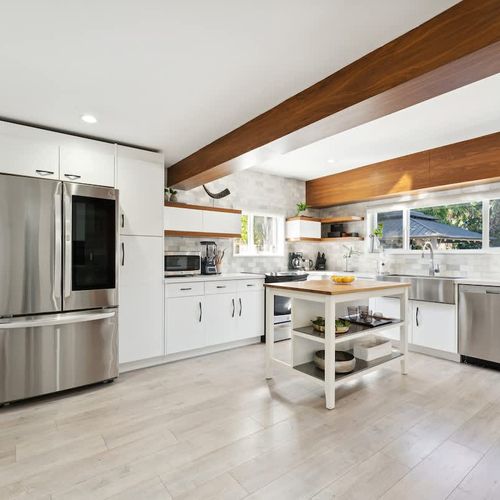 Inviting open kitchen area with spacious island, modern amenities, and plenty of room for meal prep, ideal for longer stays or family use.