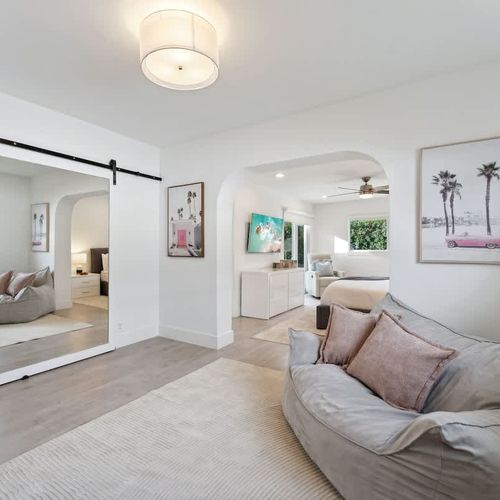 Spacious sitting area in the primary suite offering comfortable seating and a serene retreat-like feel