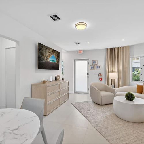 Open flow from living room to dining to kitchen, with easy access to the pool.