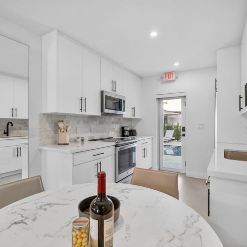 Enjoy easy access from the dining area to the kitchen, with a door that opens straight onto the pool deck.