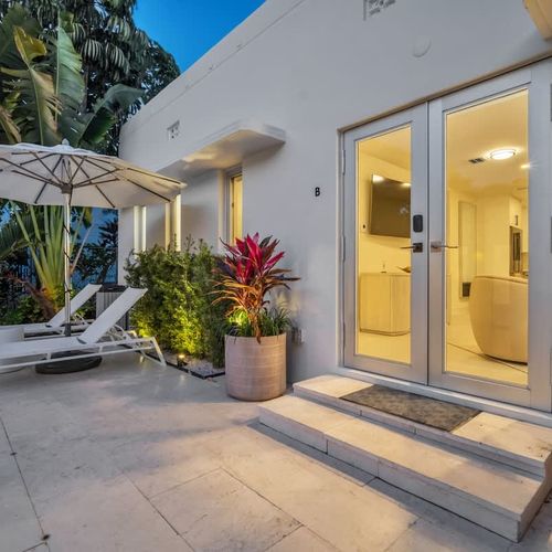 Unit B - Just steps from the living room to the sparkling pool deck—perfect for a refreshing dip anytime.