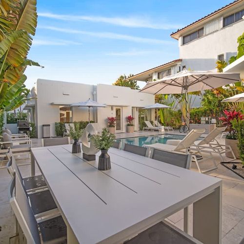 More spots to lounge outdoors while enjoying the sparkling pool and verdant surroundings.