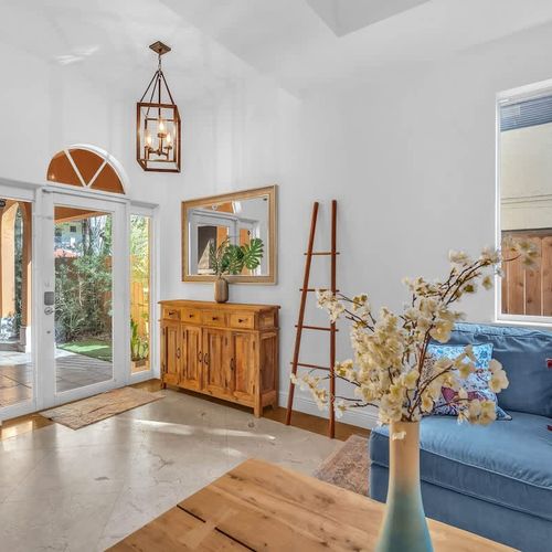 Sun-drenched interiors with large windows and garden views.