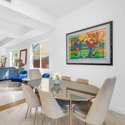 Modern dining area with comfortable seating, perfect for enjoying meals or planning your day.