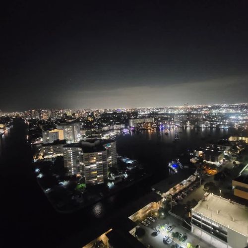 Experience the magic of the city at night with beautiful lights stretching across the skyline and canals.