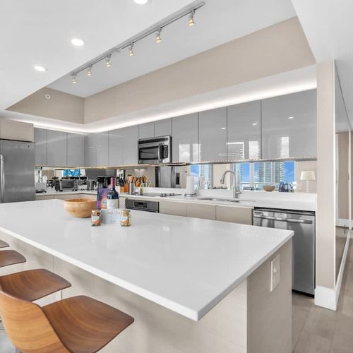 Well-equipped kitchen with modern appliances, expansive counter space, and a generous island ideal for cooking and casual gatherings.