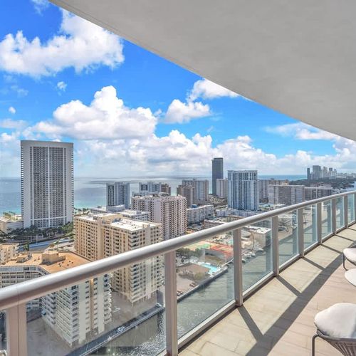 Scenic private balcony overlooking Hallandale Beach and the ocean, a perfect place to start your day with coffee, relax with a book, or take in the breathtaking views.