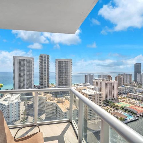 Scenic private balcony overlooking Hallandale Beach and the ocean, a perfect place to start your day with coffee, relax with a book, or take in the breathtaking views.
