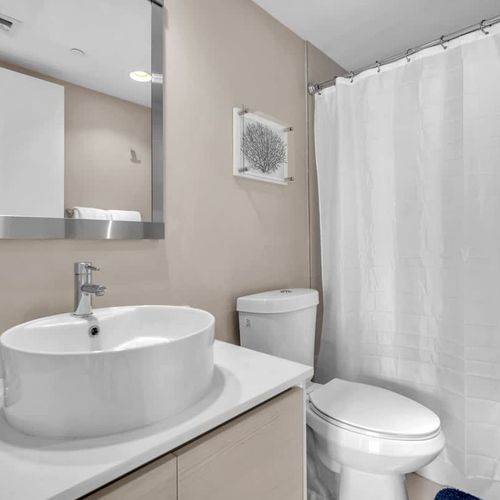 Full bathroom 2 equipped with essential amenities, featuring a sink, toilet, and shower for everyday convenience.
