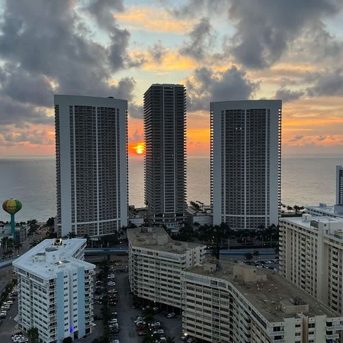 Wake up to breathtaking sunrise views over the ocean right from your balcony.