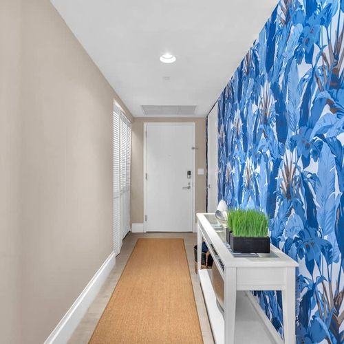 Unit entrance with a stylish entryway that leads directly into the living space and kitchen.