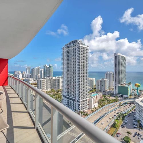Scenic private balcony overlooking Hallandale Beach and the ocean, a perfect place to start your day with coffee, relax with a book, or take in the breathtaking views.